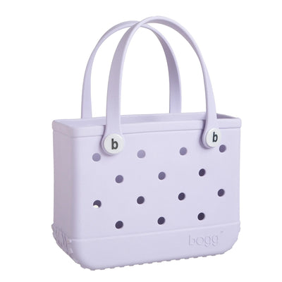 Purple handbag with two short handles and white polka dots