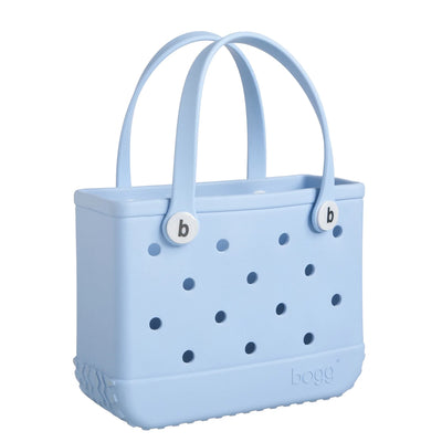 Light blue Bogg Baby Bag with  two handles. Text says  “BOGG BAG Original” and “Bogg Baby Bag”