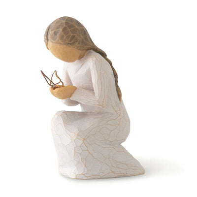 hand-painted resin figure in cream dress, kneeling with a gold leaf wire butterfly alighted