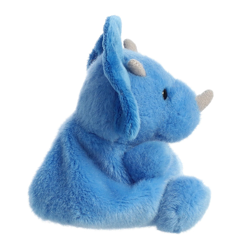 Blue plush dinosaur toy with short horns and yellow chest