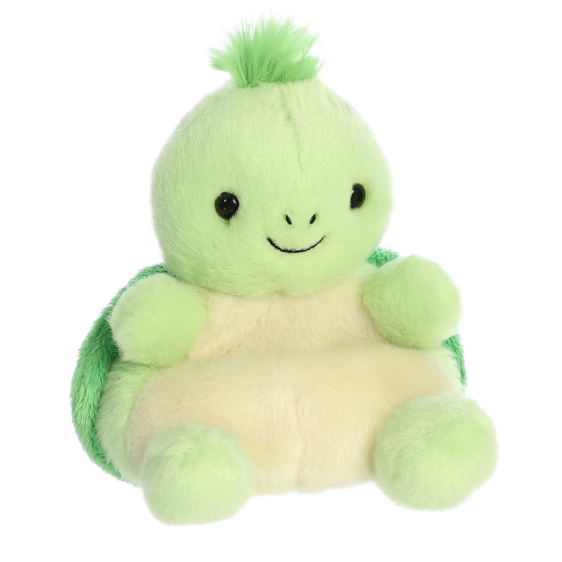 Small green plush turtle sitting in plaid armchair.